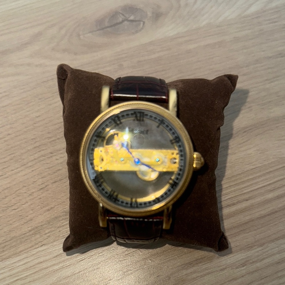 Gold Skeleton Dial Watch with Dark Strap